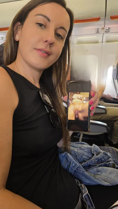 The passengers nearby don't realise how naughty I am