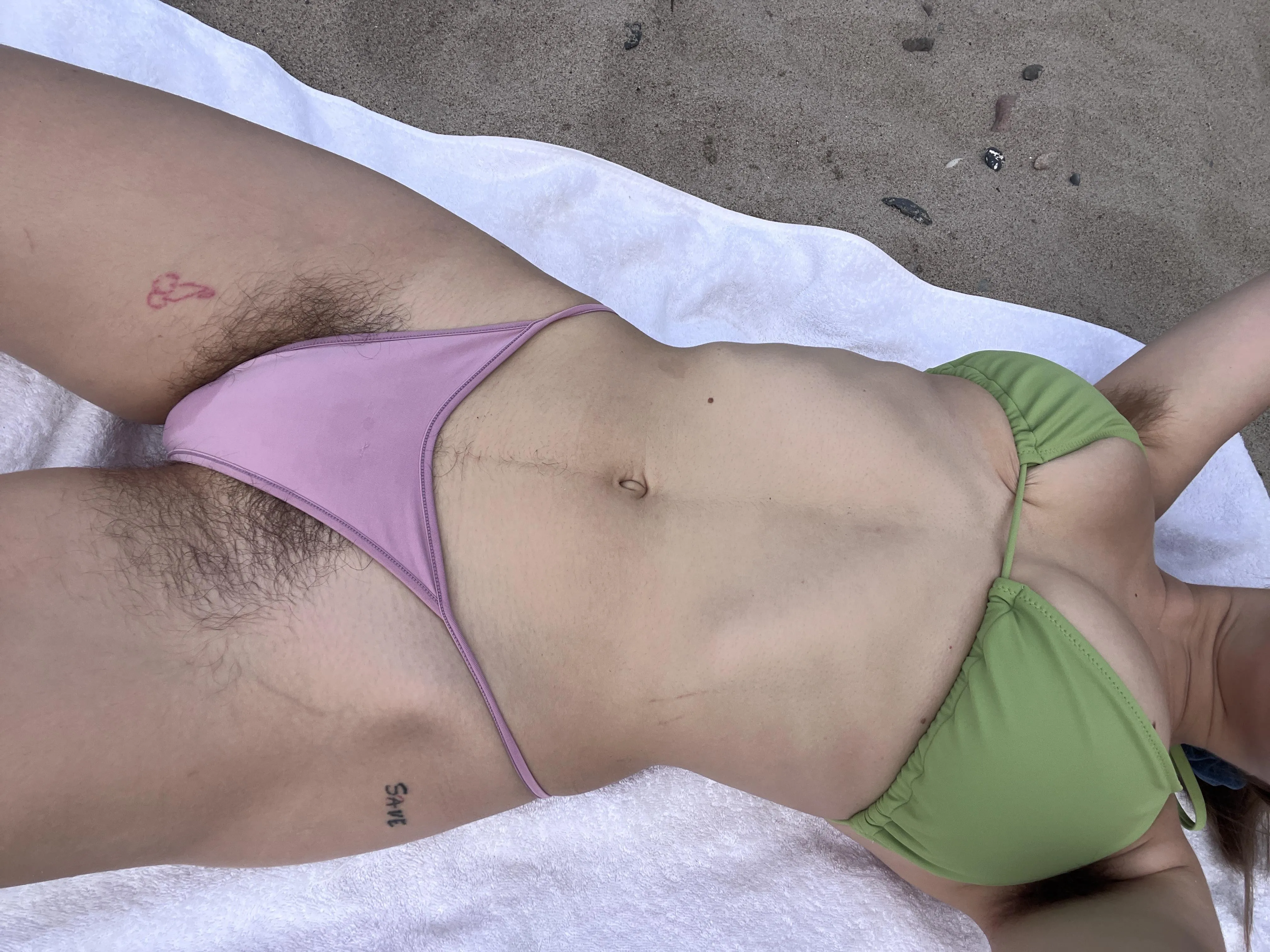 serving full bush in a bikini at the beach