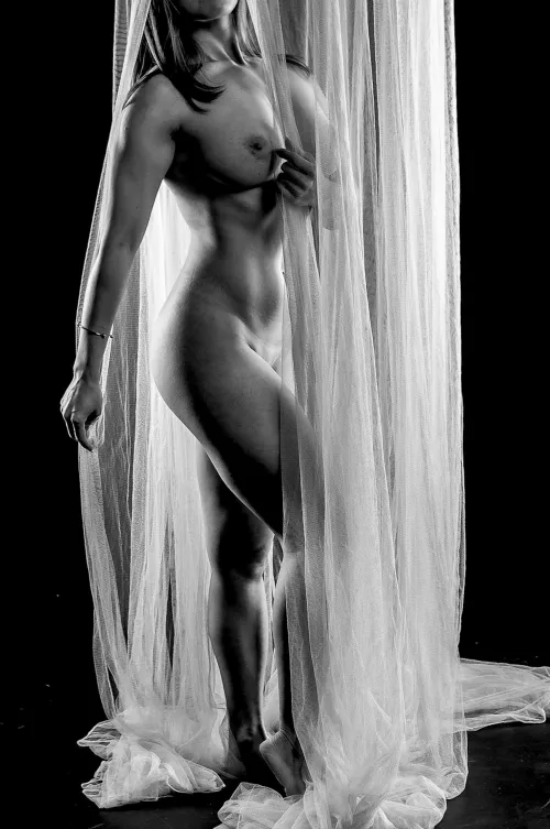 Between light and shadow, she danced with vulnerability and power.