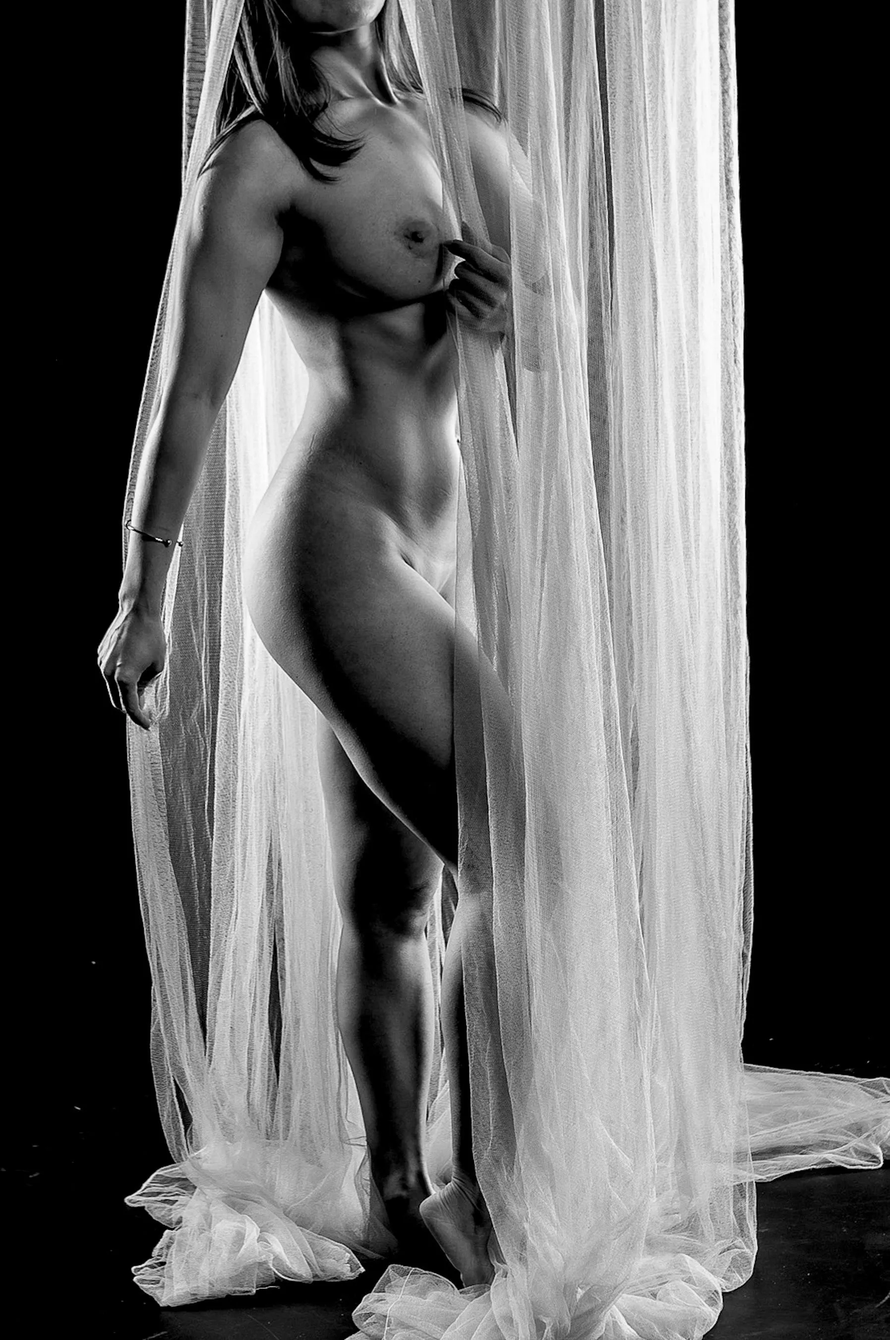 Between light and shadow, she danced with vulnerability and power.