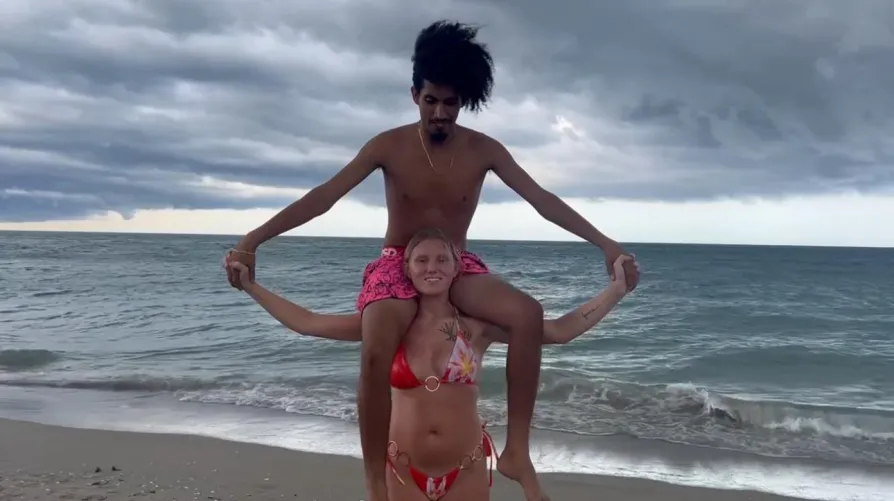 Cay Baby Lifts And Carries Jose At The Beach
