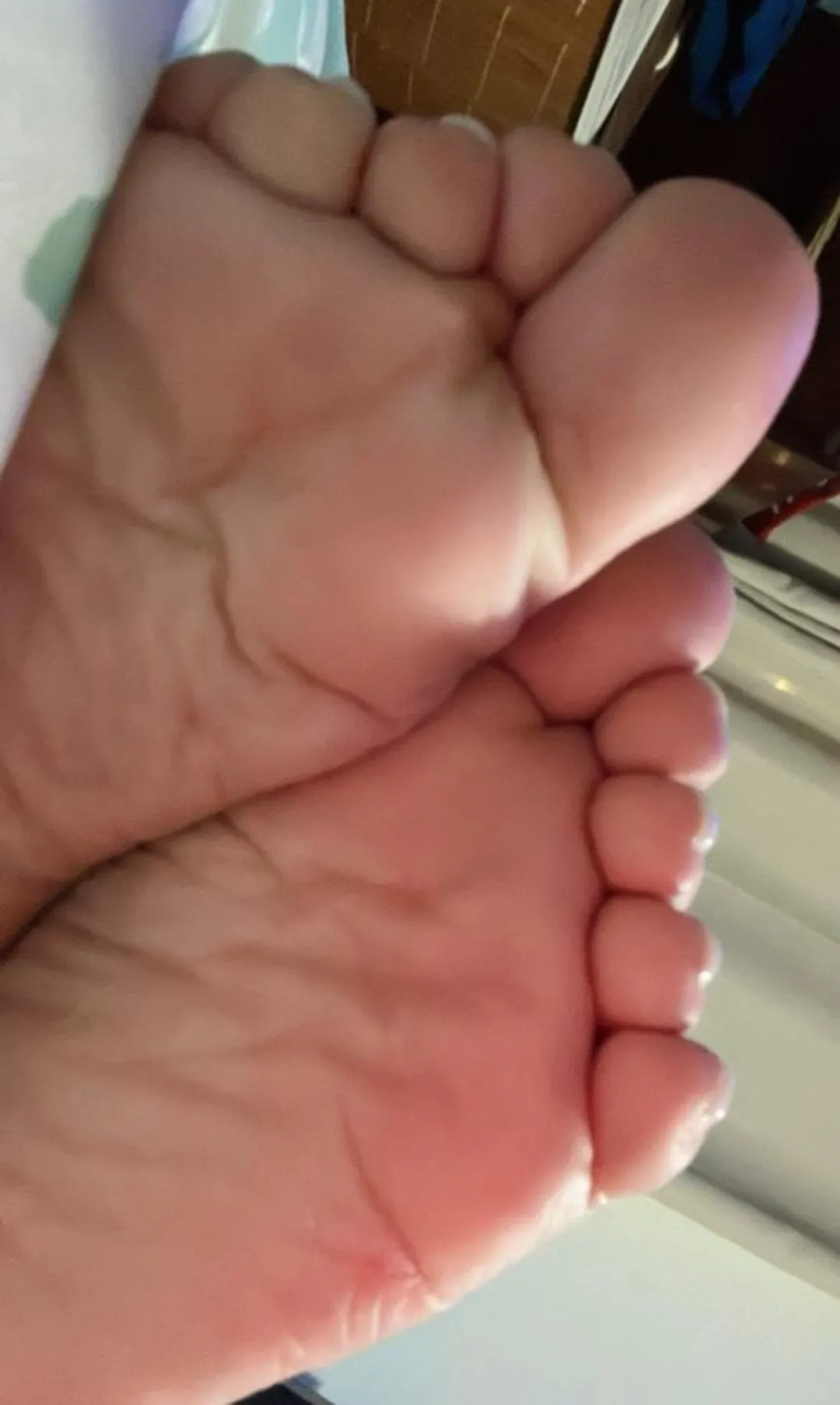 A couple of wrinkly soles and a bunch of toes right on your face.