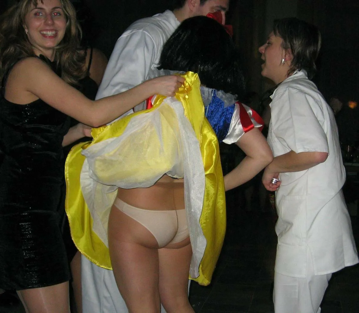 Snow White’s skirt lifted revealing tights with panties underneath