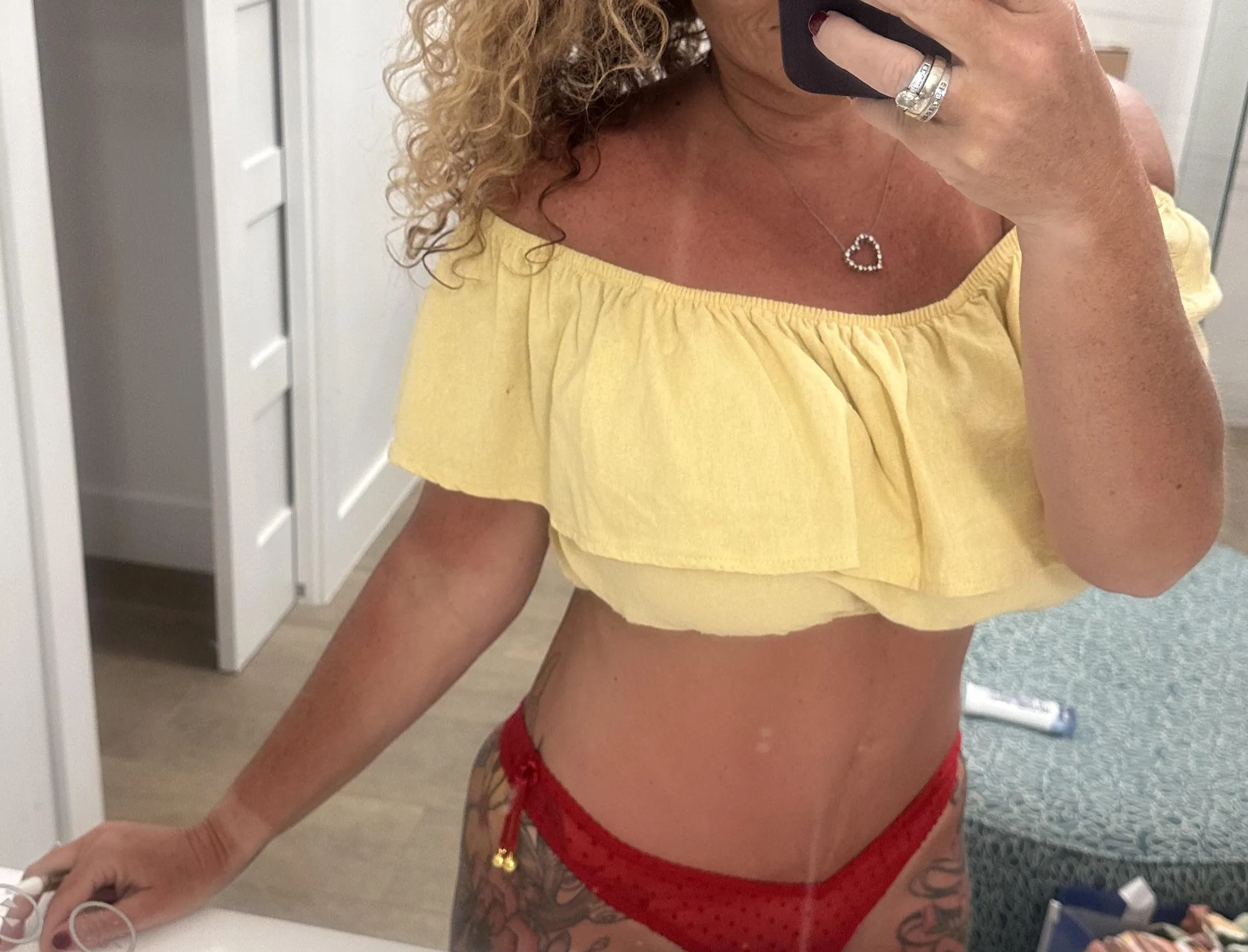 Look close to see the freckles on my chest unless you want to look at my sexy curves instead.