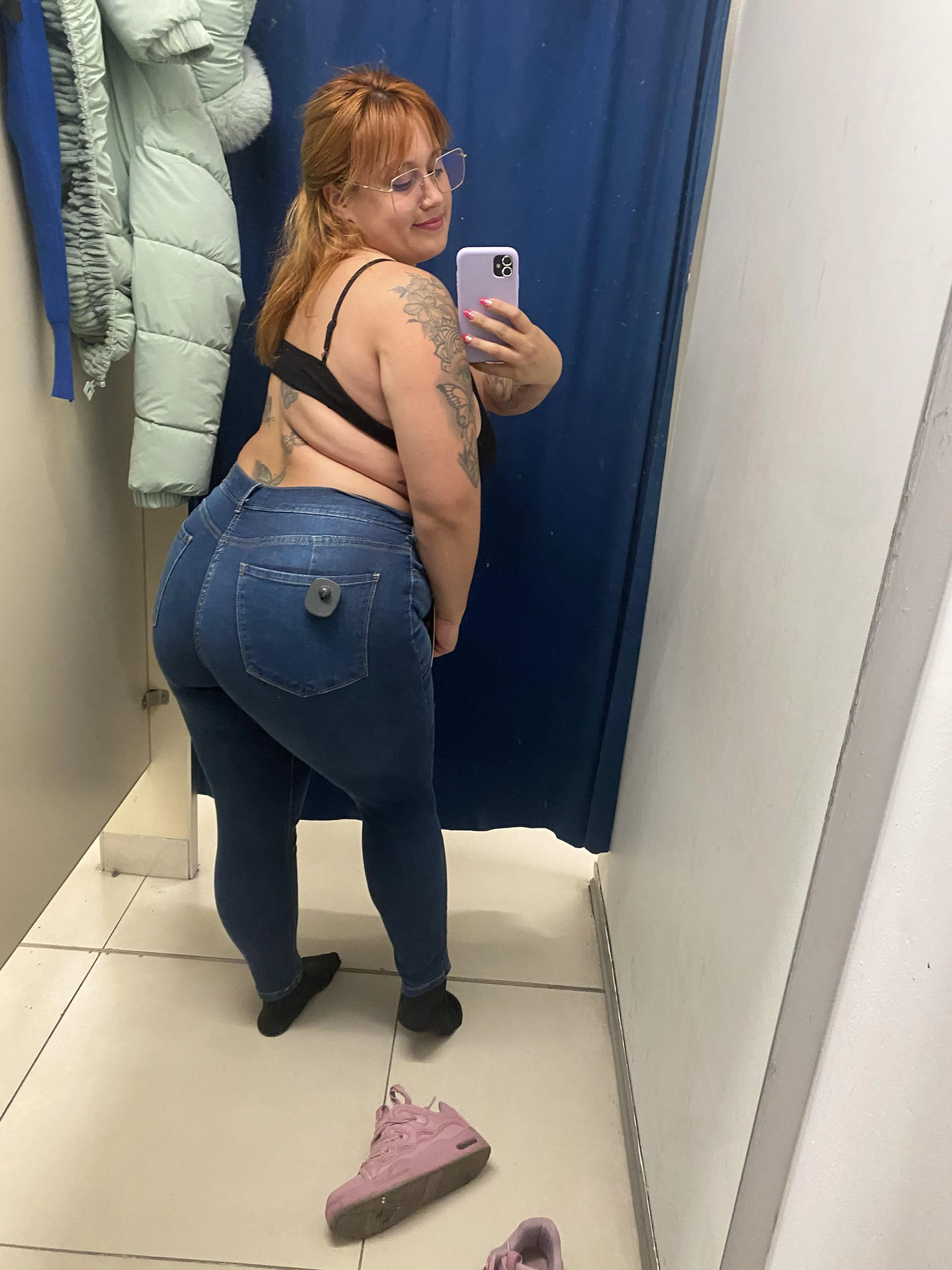 trying on clothes at the mall