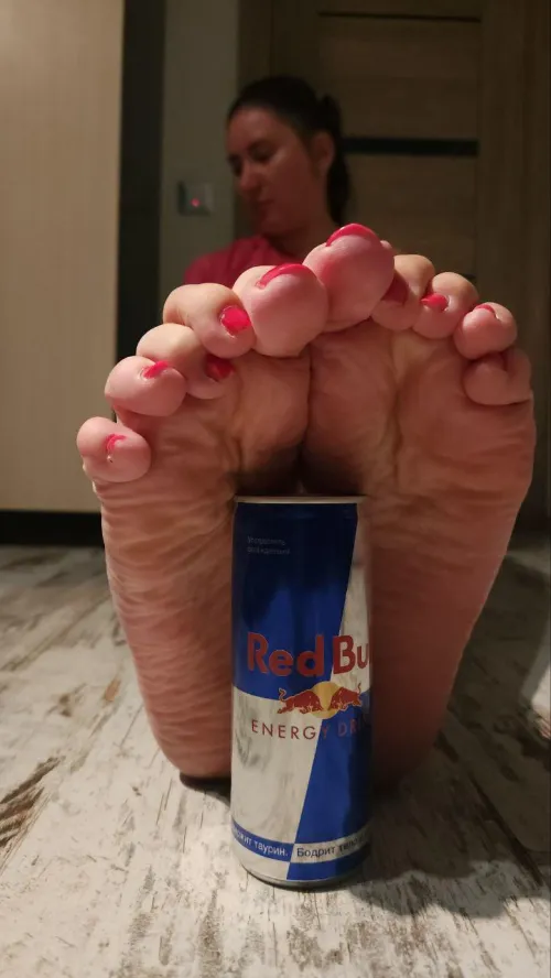 My big wrinkled feet covering the normal sized RedBull