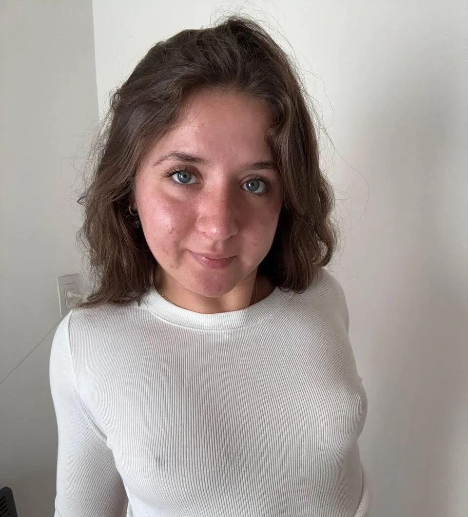 The early morning face of a woman: messy hair, bare face, perky nips