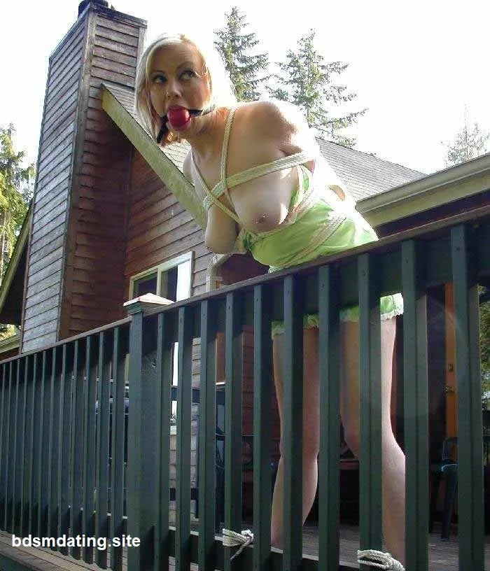 Helpless beauty, tied to the terrace