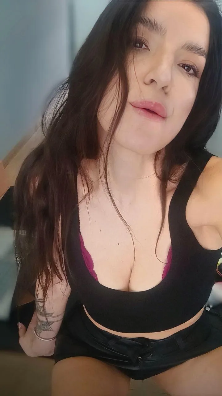 Glossy pink lips just waiting to be kissed.