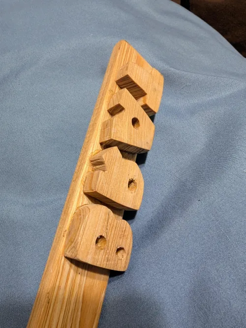 The BRAT paddle. Thick, raised, closely-spaced letters that leave the entire imprint on a bratty body