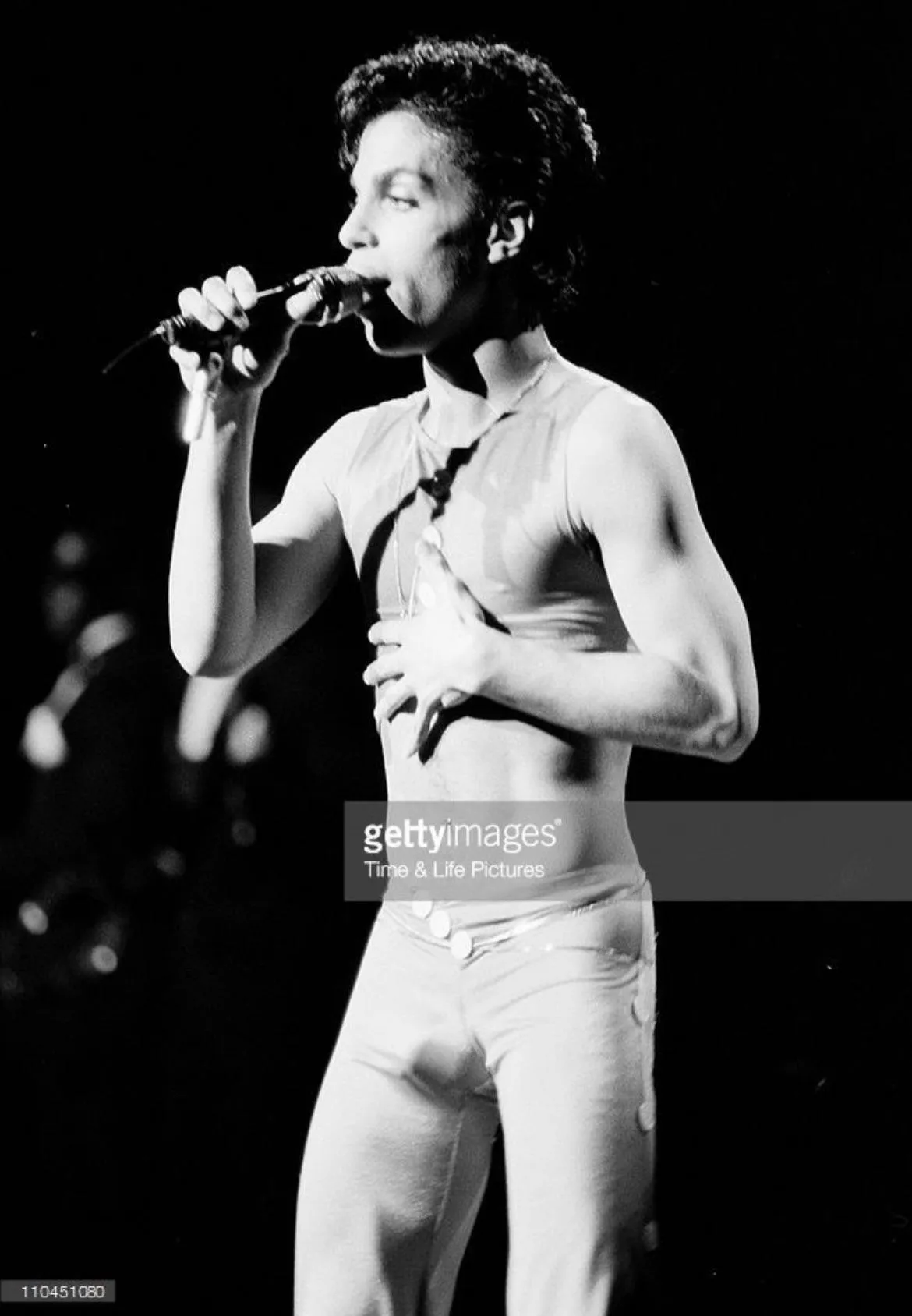 Prince on stage with nothing underneath his skin tight pants