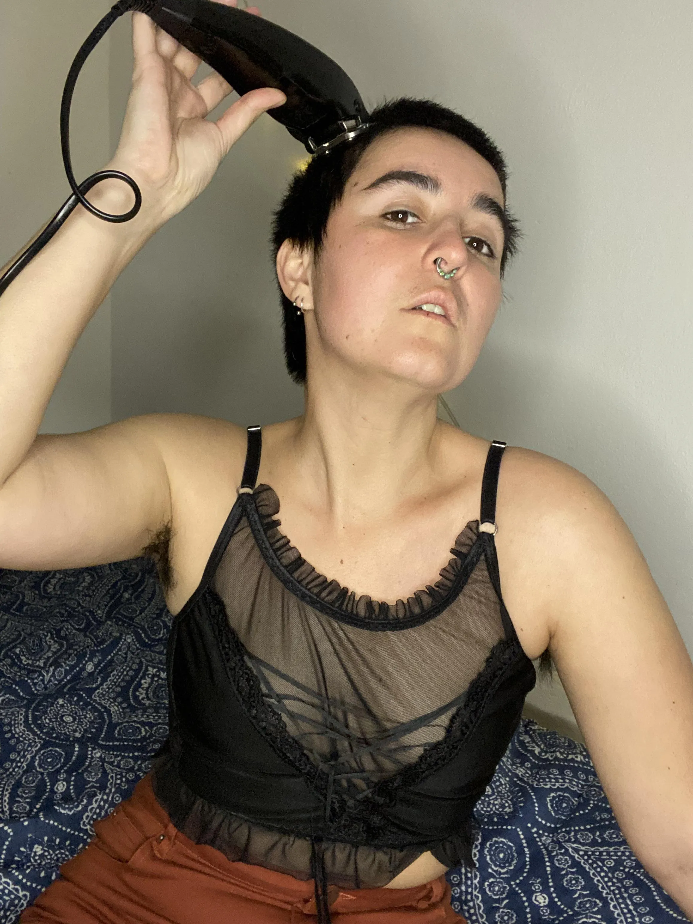 Addicted to the sound of the clippers sliding over my head.