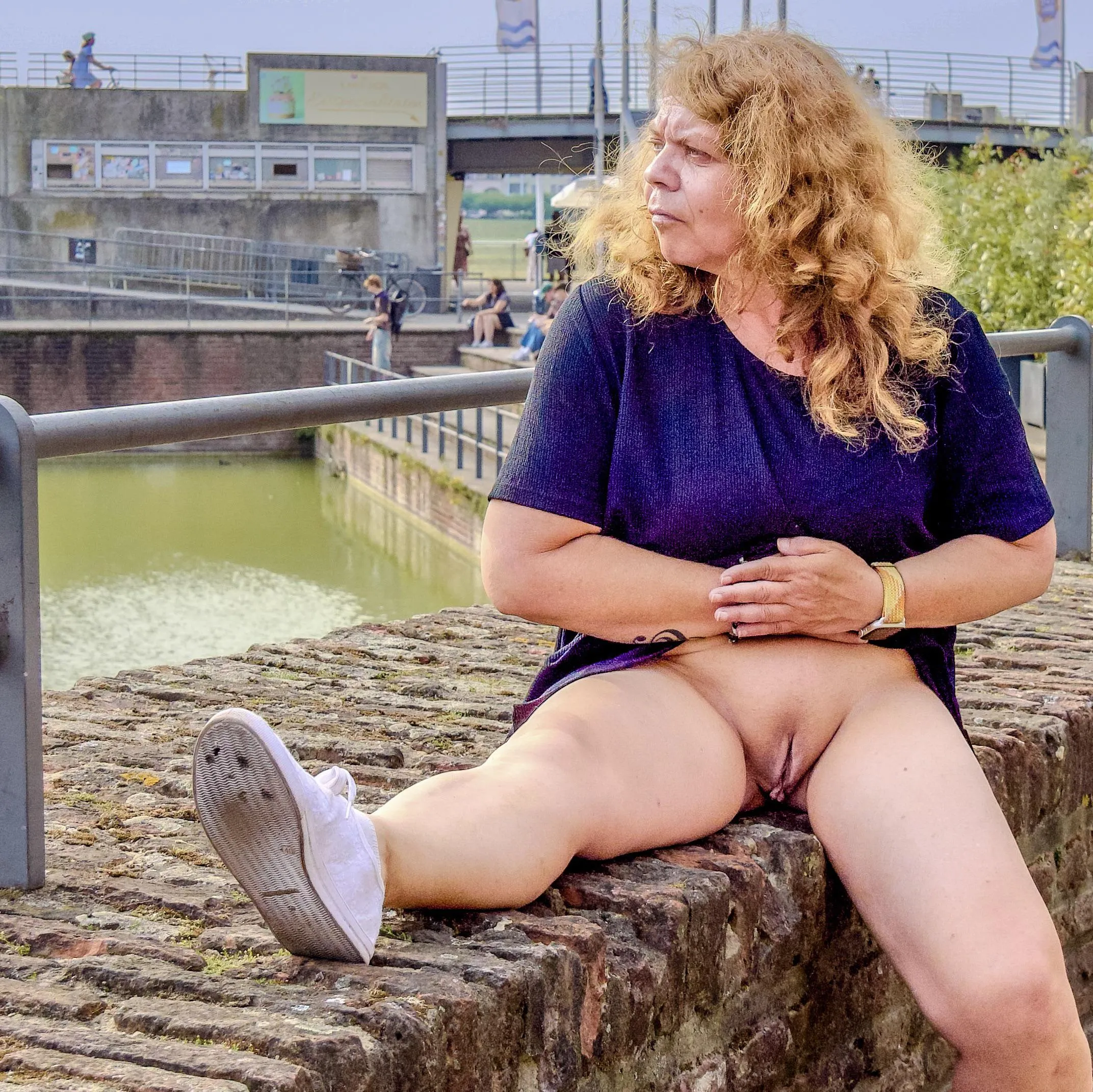 It's really cool to sit so relaxed on the wall and simply forget about the passersby. Just ignore the fact that men are secretly taking photos of my little cunt with their phones.