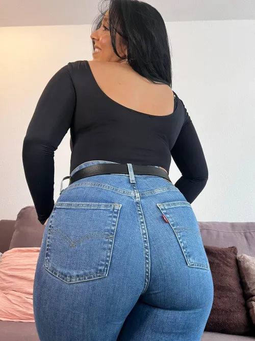 Sunlit and barely contained in Levis blazing with playful fire summers boldest shoreline queen