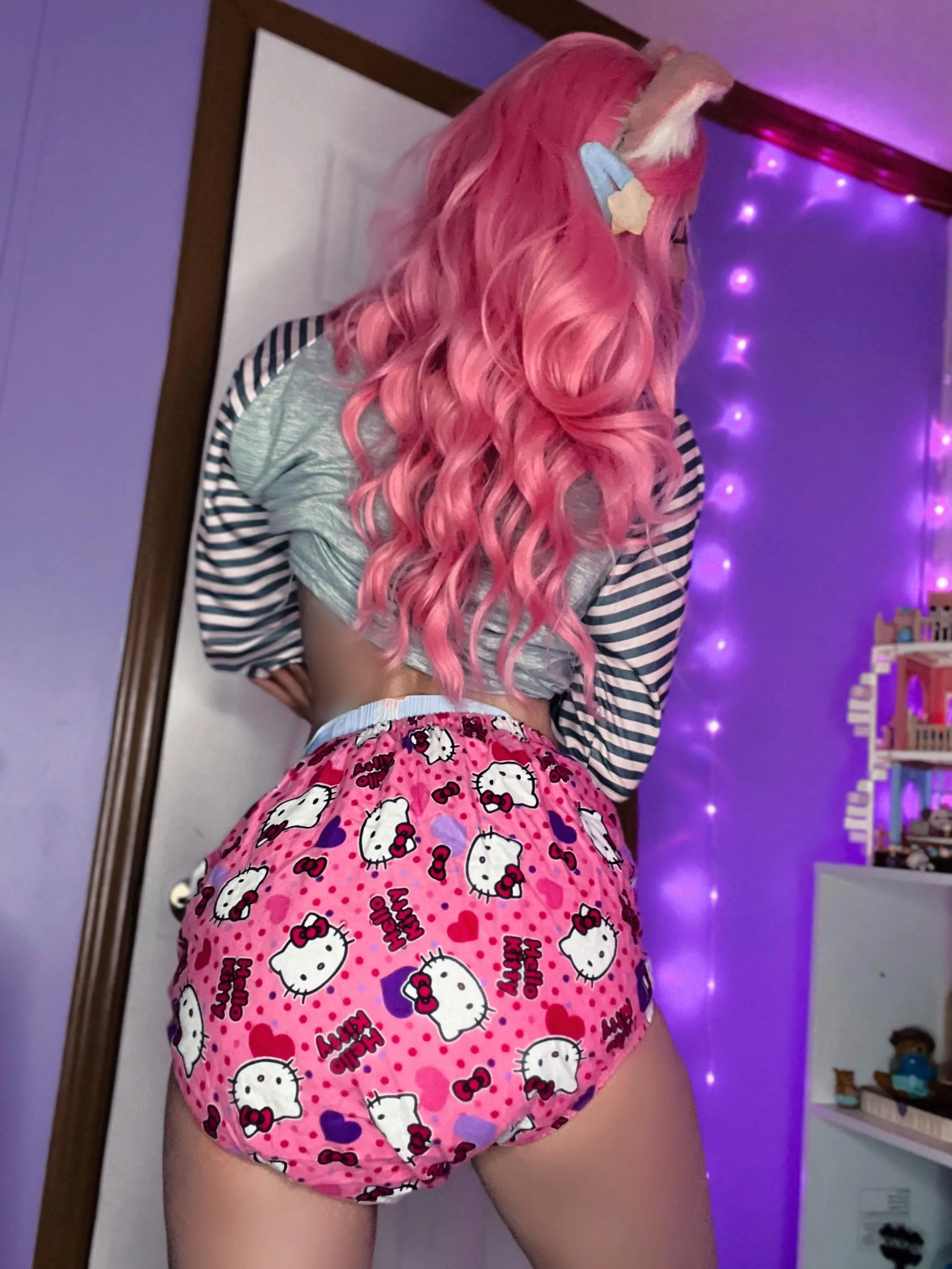 I bet you could never guess the diaper I’m wearing under these plastic pants