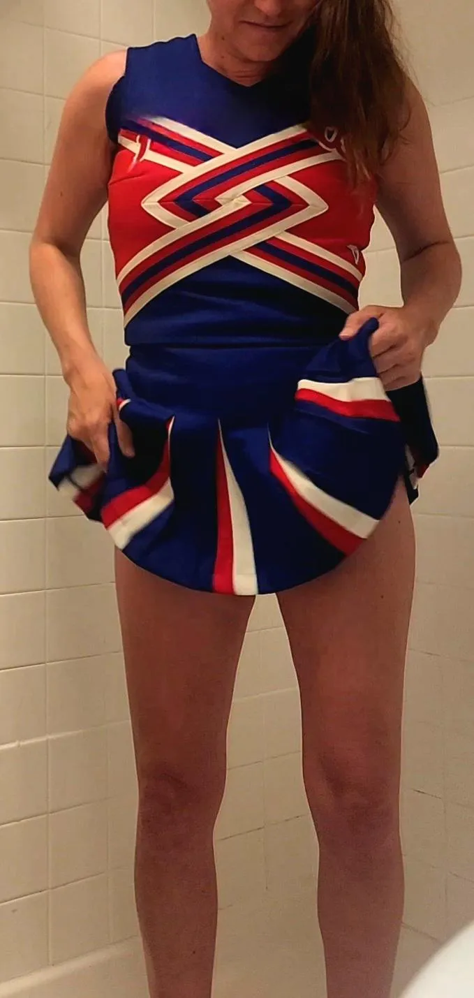 Trying on my high school cheerleader outfit. What do you think? Does this mom still have it?