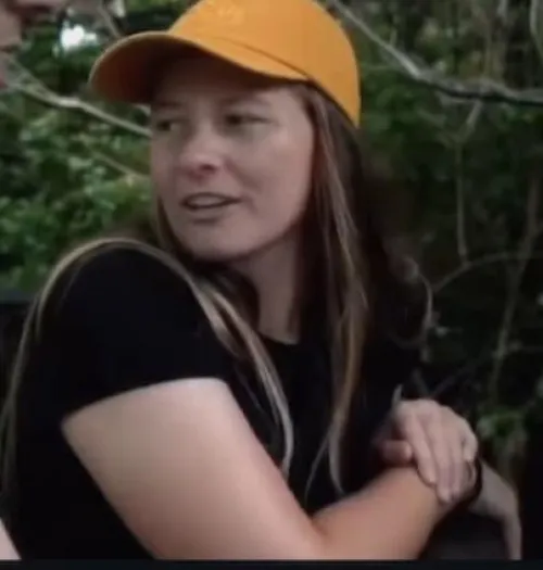 College softball player willing to pose for camera for school assistance