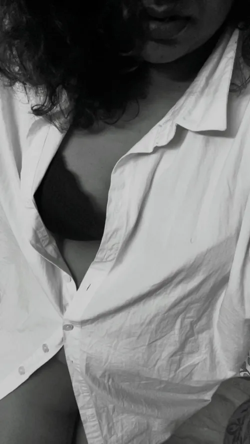 Down, not my blouse. But his shirt.