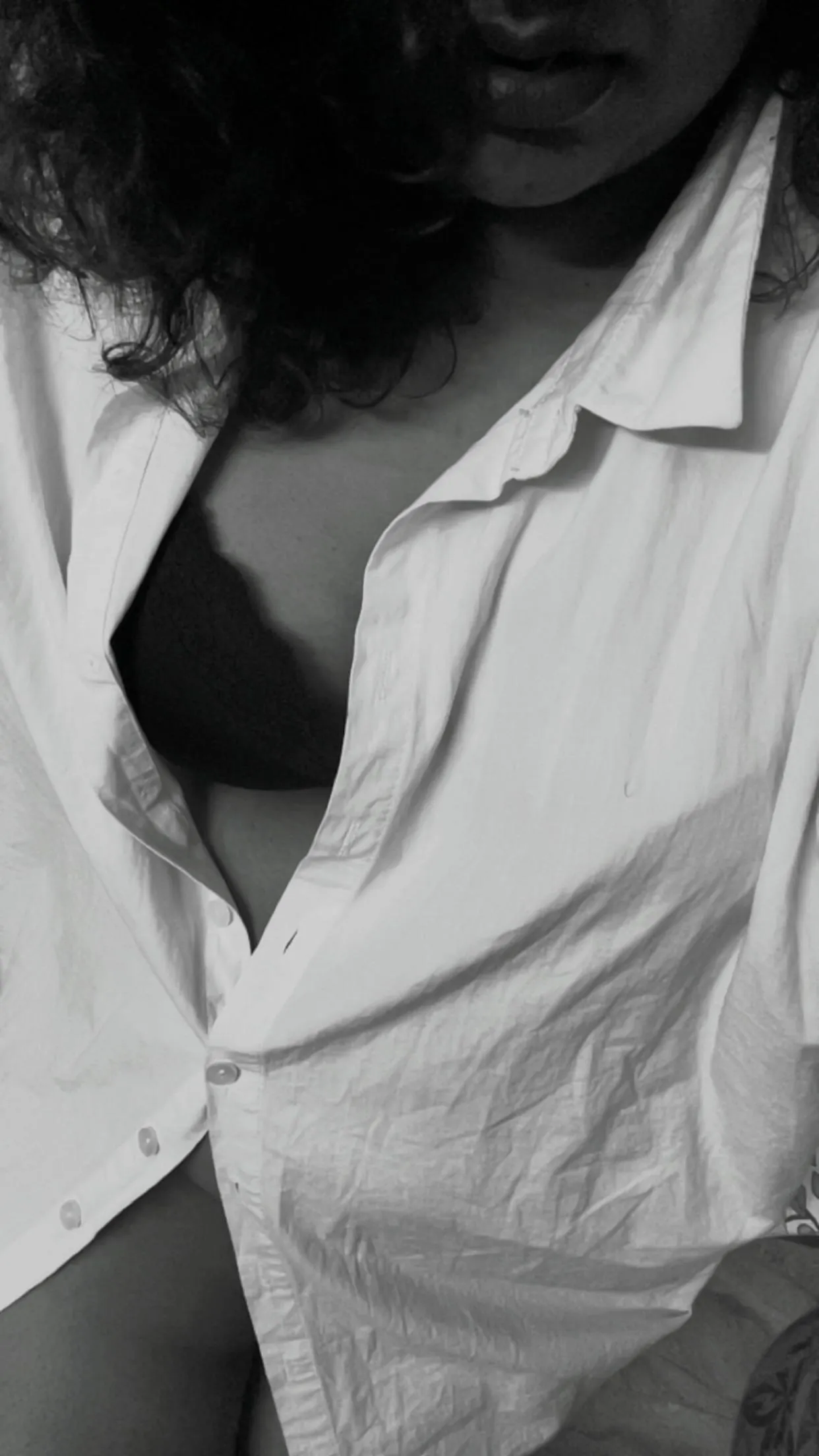 Down, not my blouse. But his shirt.