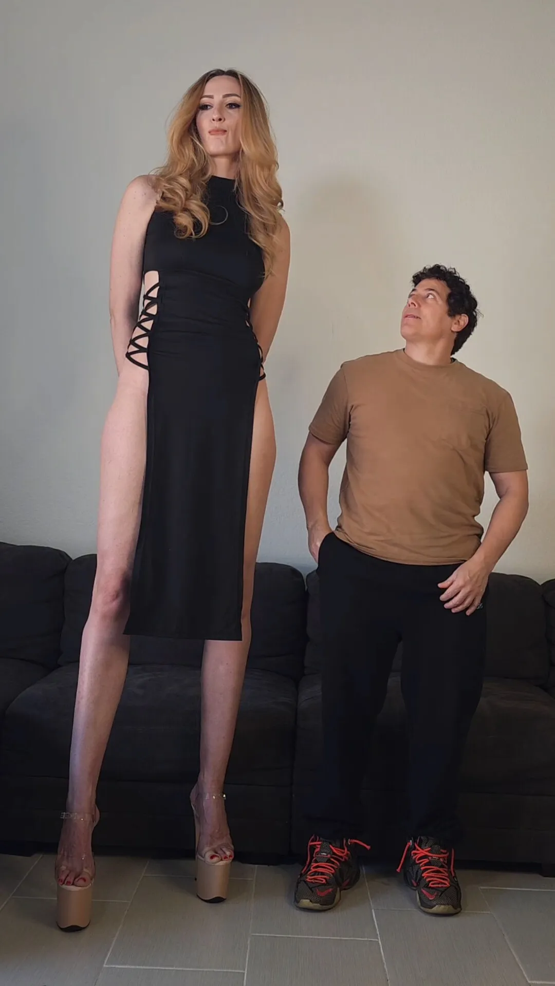 Tall goddess beating up a guy