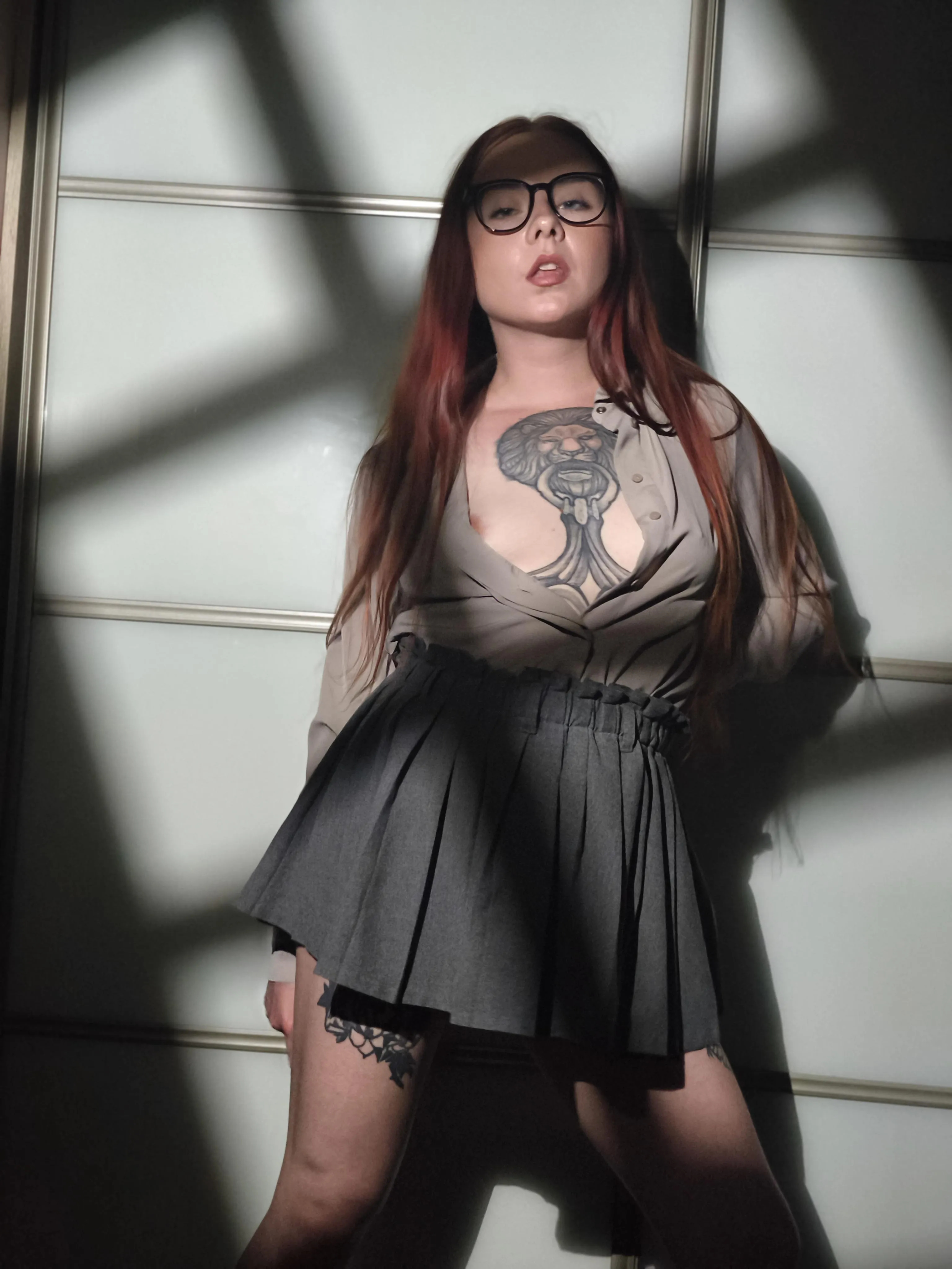 Blouse unbuttoned wide, tits spilling out for late-night desk cock slam.