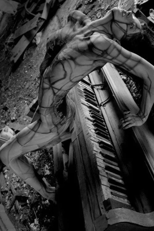 Young beauty and an old piano