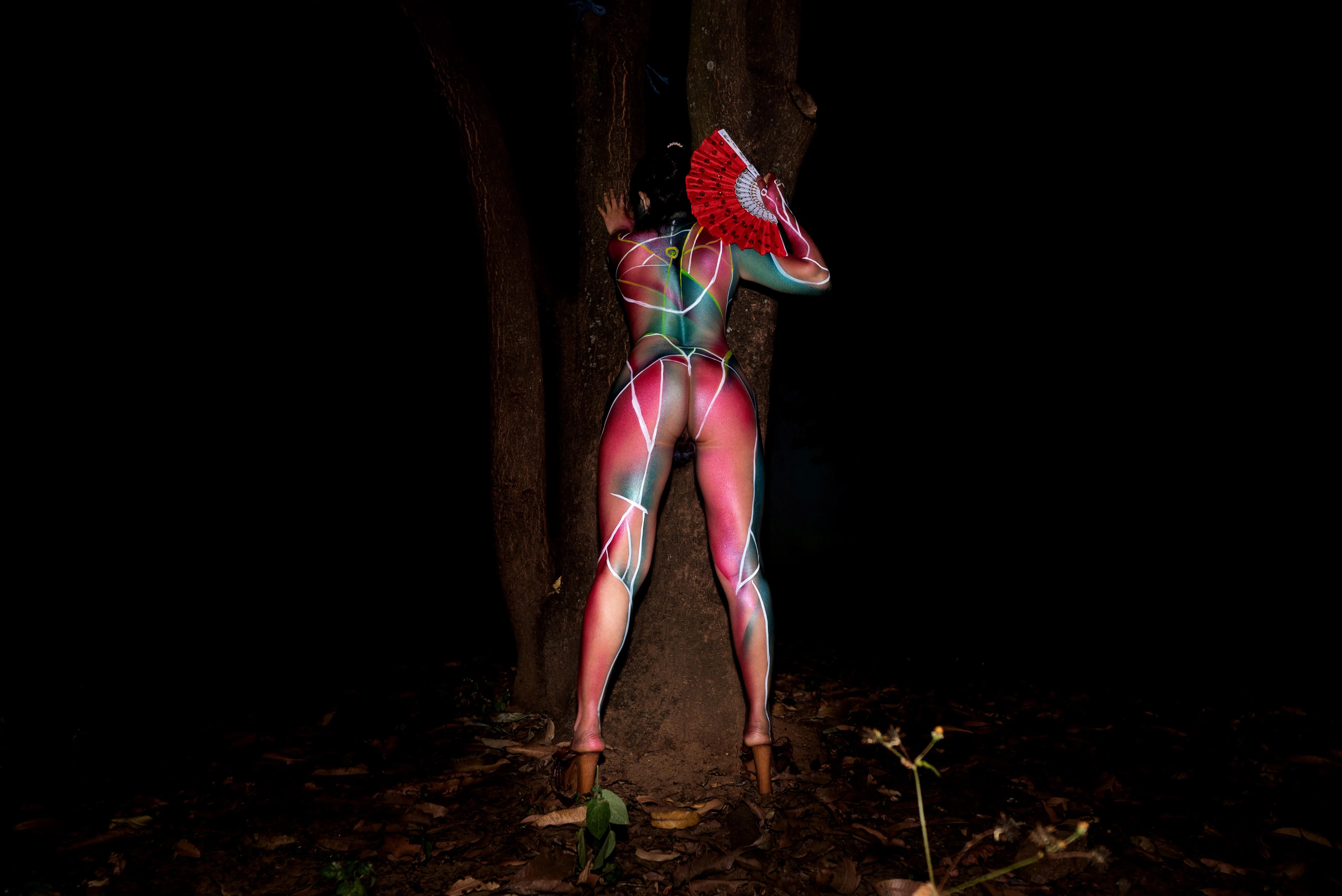 Nude bodypaint in the forest