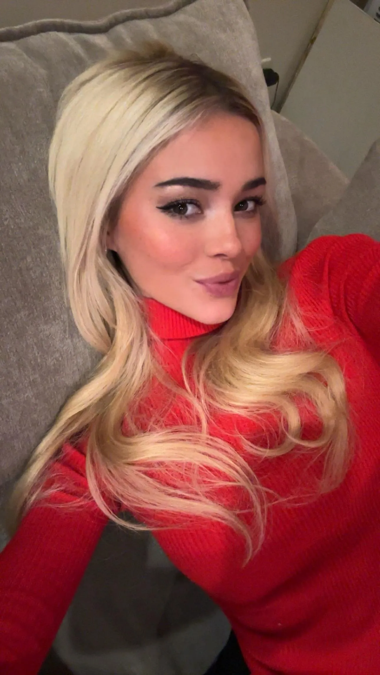 Christmas selfie in red dress - IG December 2025