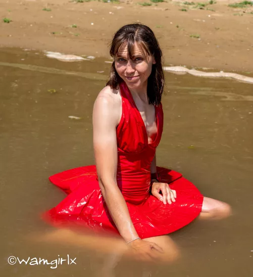 I just love this pic so much taken from my new wetlook video. I loved the way my red dress floated on top of the water.