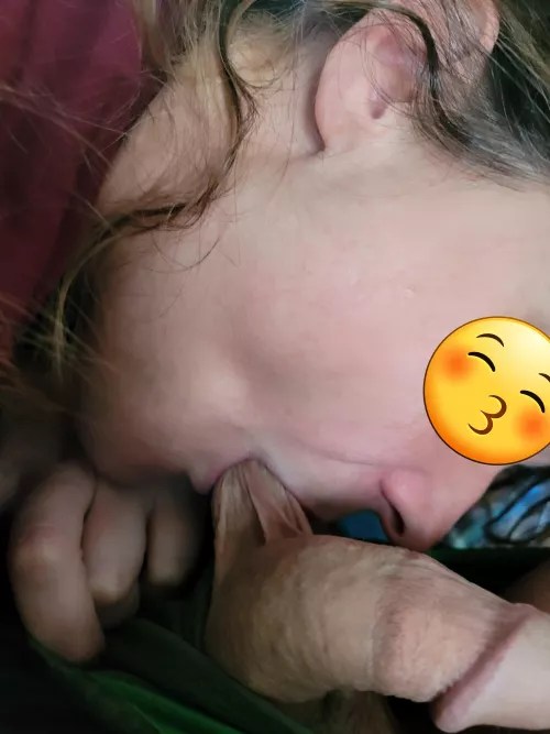 taking a ball deep in her mouth.