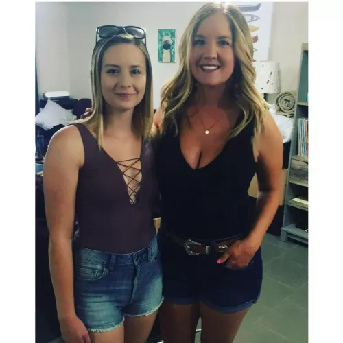 The meek girl on the left struggling to force a smile.