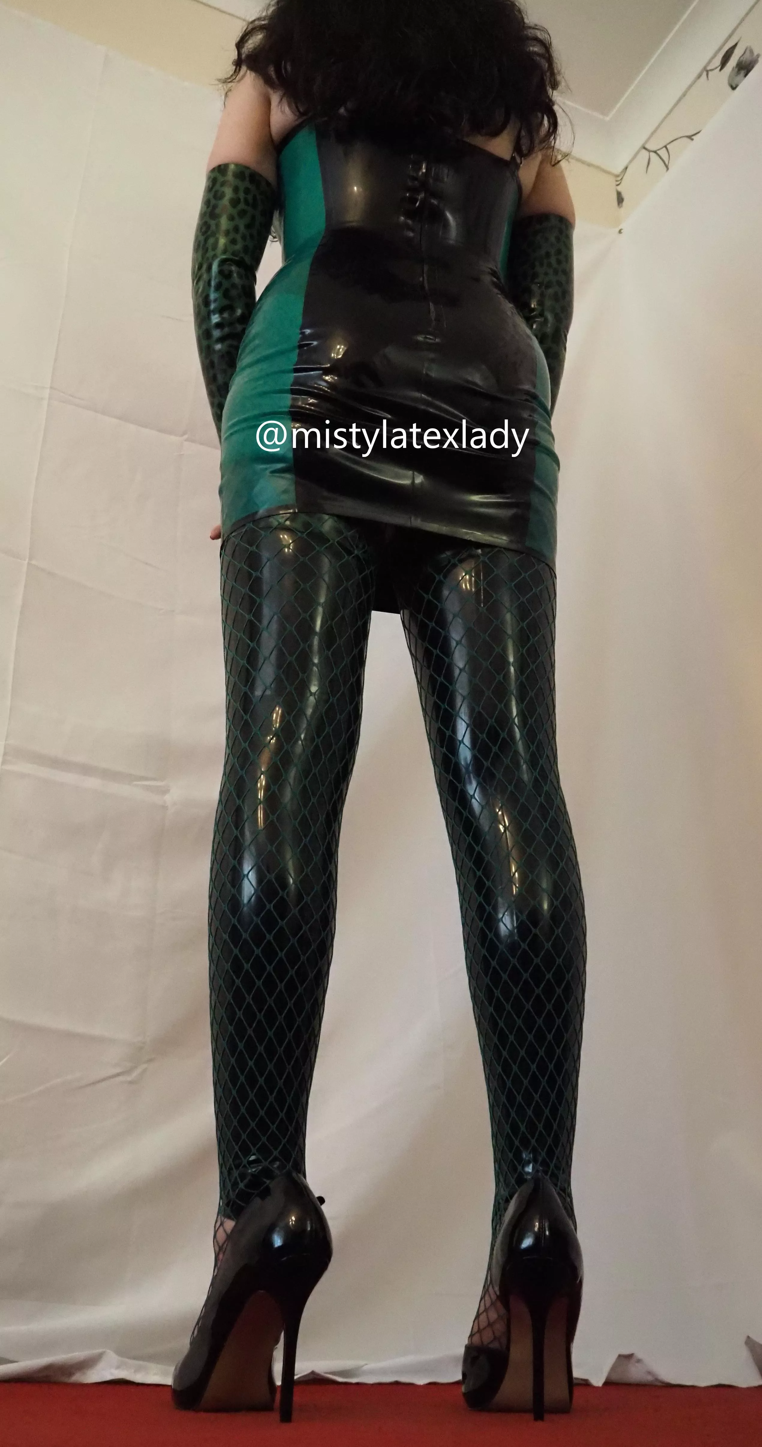 This is my new latex outfit from behind. Do you want to have a guess who I am portraying?