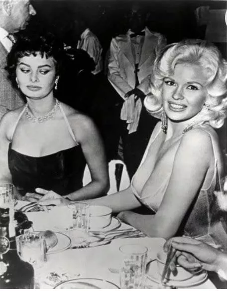 One of the first examples of breast envy. Sofia Loren gives side-eye to Jayne Mansfield’s ample bosom.