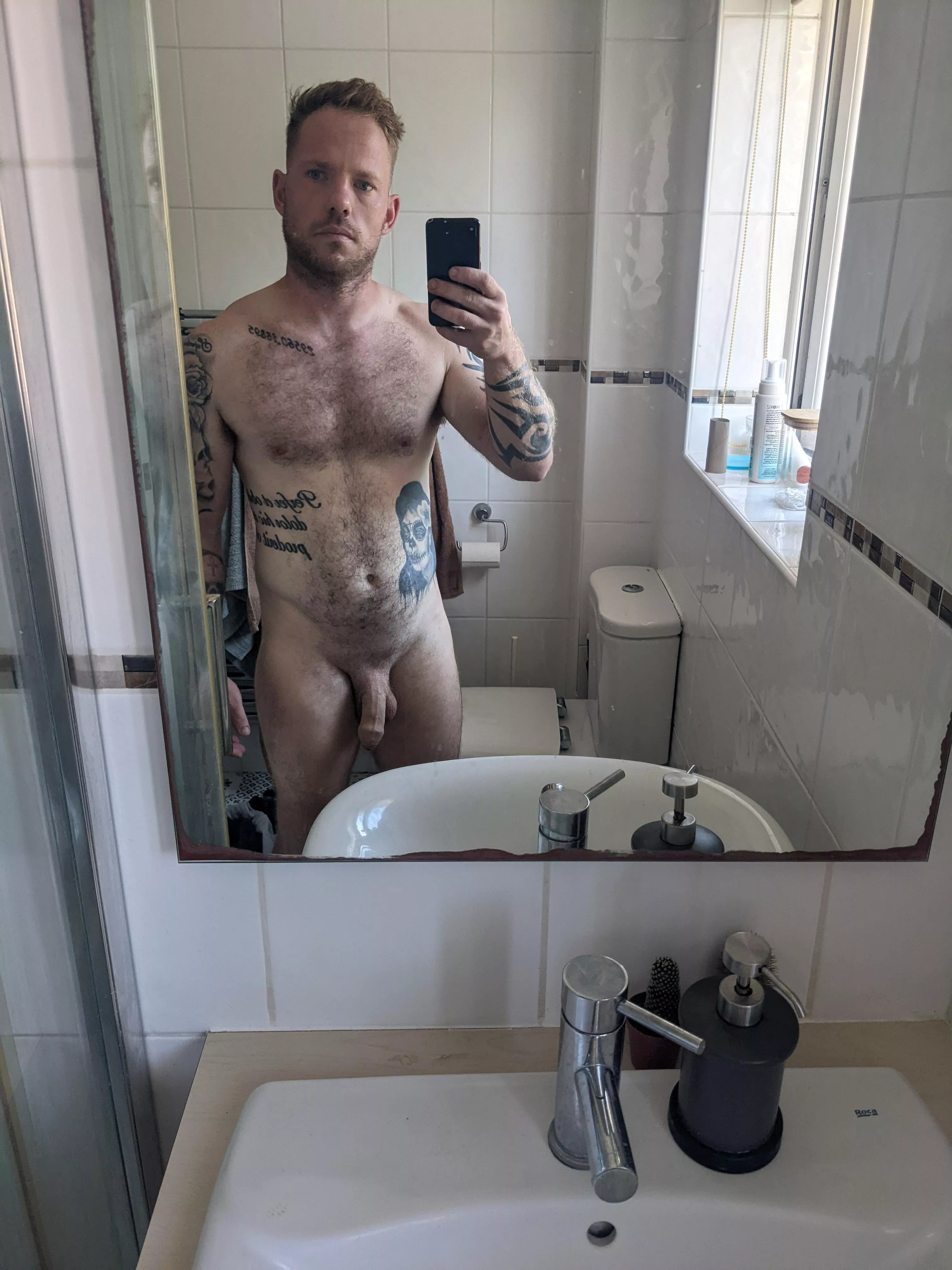 me looking grumpy, taking a photo of myself naked [m]31