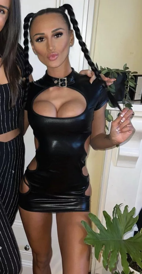 tits bursting out , leather dress , pigtails , she’s perfect