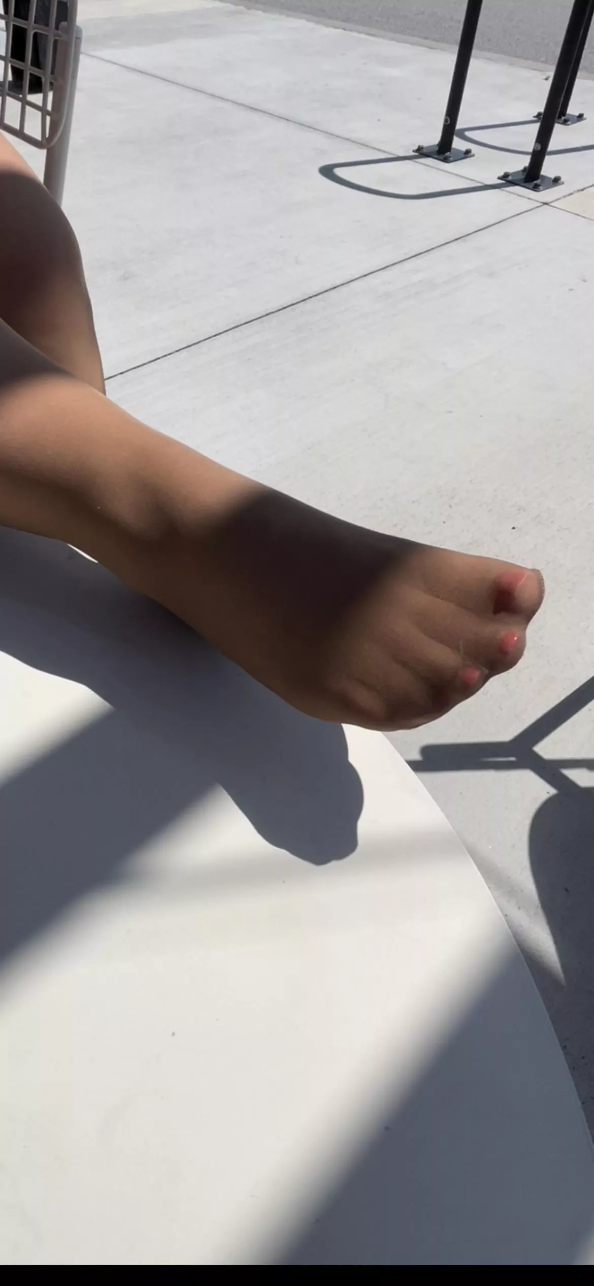 Soaking up some sun in my suntan pantyhose.