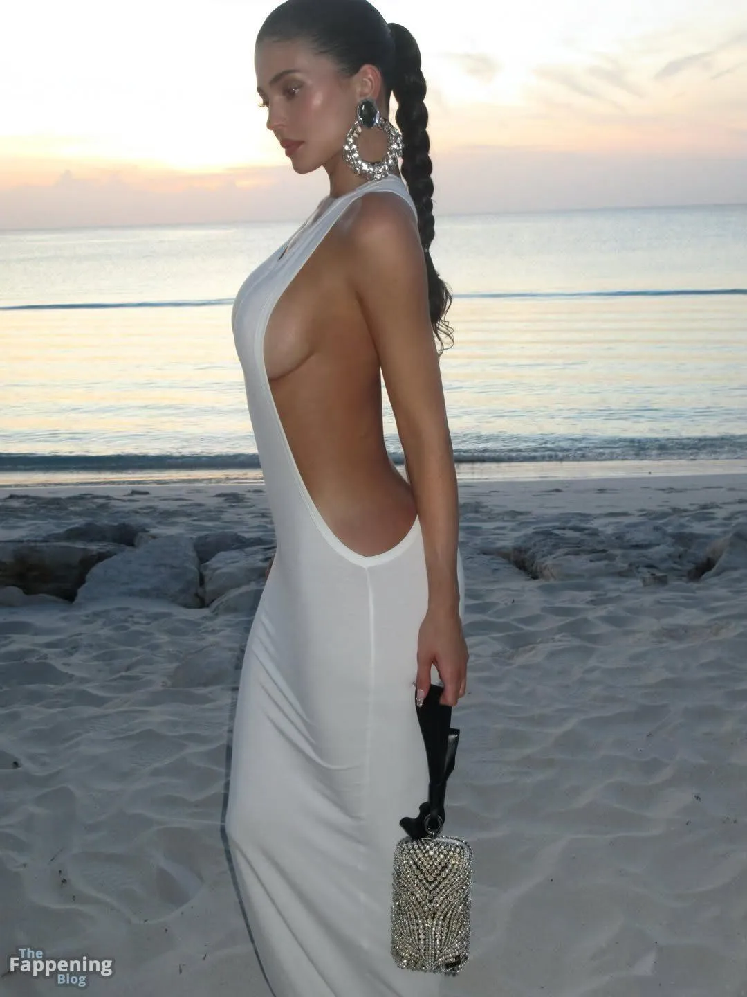 Kylie Jenner Poses Braless in a White Dress on the Beach (6 Photos + Video)